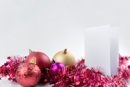 Empty paper and a Christmas ornament on white background. Christmas decoration. Empty paper for copy spaceの写真素材