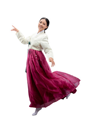 Asian woman wearing a traditional Korean national costume, Hanbok, standing isolated over white backgroundの写真素材
