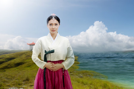 Asian woman wearing a traditional Korean national costume, Hanbok, standing beside the lake with...