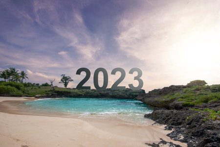 2023 on the beach with a sunset sky background. Happy New Year 2023の写真素材