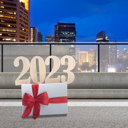2023 and gift box on the street with a cityscape background. Happy New Year 2023
