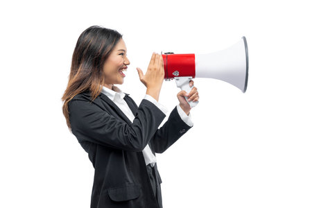 Asian businesswoman talking in megaphone isolated over white backgroundの写真素材
