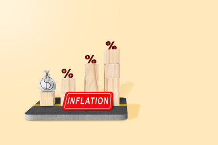Increased interest rate graph with inflation sign on a colored backgroundの写真素材