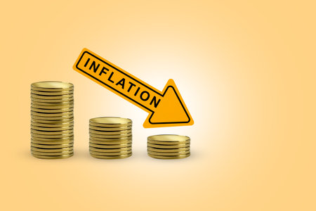 Decreased coin graph arrow with inflation sign and colored backgroundの写真素材