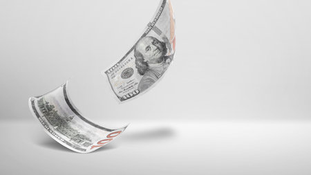 Flying dollars on gray backgroundの写真素材