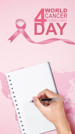 Human hands writing on a notebook with a purple ribbon on a colored background. World Cancer Dayの写真素材
