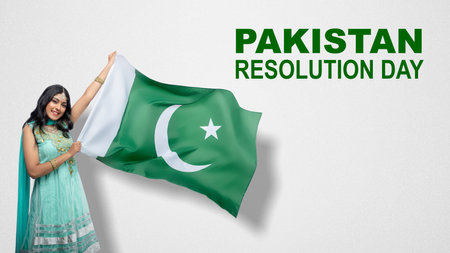 Asian woman holding Pakistan flag. Pakistan Resolution Dayの写真素材