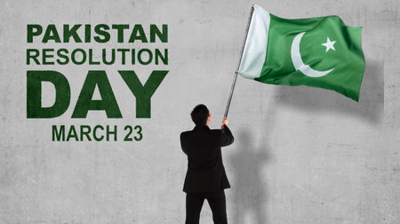 Rear view of Asian businessman holding Pakistan flag. Pakistan Resolution Dayの写真素材