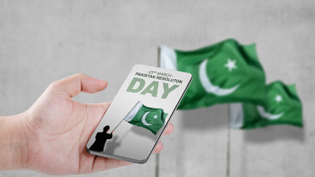 Rear view of Asian businessman holding Pakistan flag. Pakistan Resolution Dayの写真素材