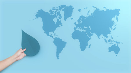Human hand holding water drop. World Water Day