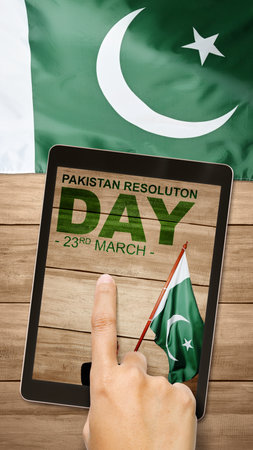 Rear view of Asian businessman holding Pakistan flag. Pakistan Resolution Dayの写真素材