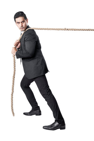 Asian businessman pulling the rope isolated over white background