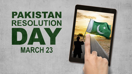 Rear view of Asian businessman holding Pakistan flag. Pakistan Resolution Dayの写真素材