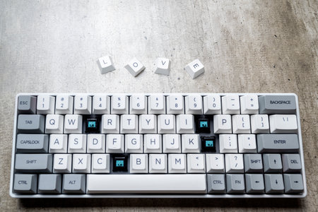 Mechanical keyboard button with "love" text on textured backgroundの写真素材