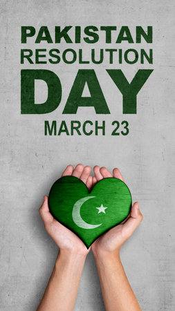 A human hand holding a heart with the Pakistan flag symbol. Pakistan Resolution Dayの写真素材