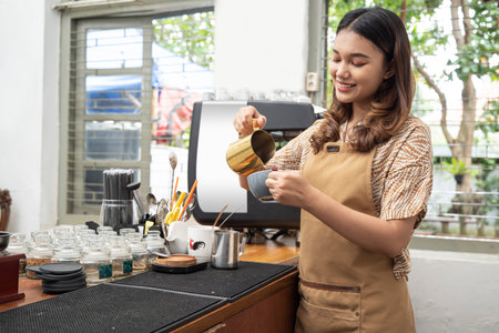 Asian woman baristas preparing coffee in the cafeの写真素材