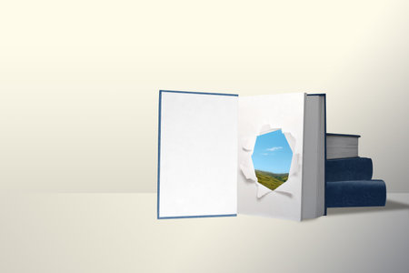 Opened book and stacked books on white background. World Book Day Conceptの写真素材