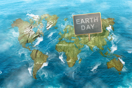 Wooden board with Earth Day message on the earth. Earth Day Conceptの写真素材