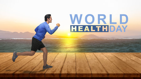 Asian man running on the wooden floor. World Health Day Conceptの写真素材