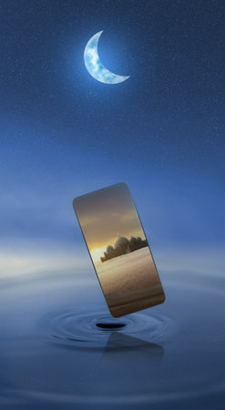 Mobile phone screen with a view of the mosque with the sunset scene backgroundの写真素材