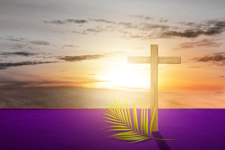 Cross and palm leaf with sunset scene background. Palm Sunday Conceptの写真素材