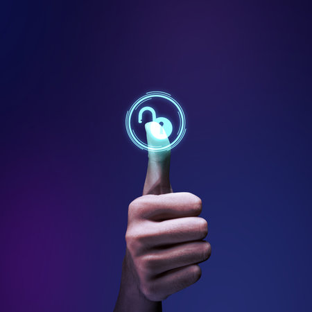A human hand pushes the virtual button with a security symbol on a colored backgroundの写真素材