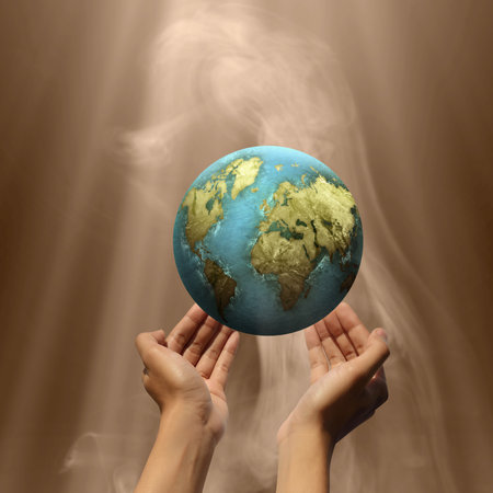 Human hand holding the earth. Earth Day Conceptの写真素材