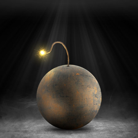 Ball bomb with a burning fuse on dark backgroundの写真素材