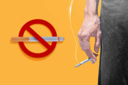Closeup view of a man smoking a cigarette. World No Tobacco Day Conceptの写真素材