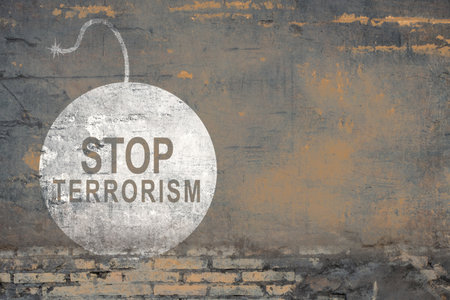 Bricked wall with stop terrorism signの写真素材