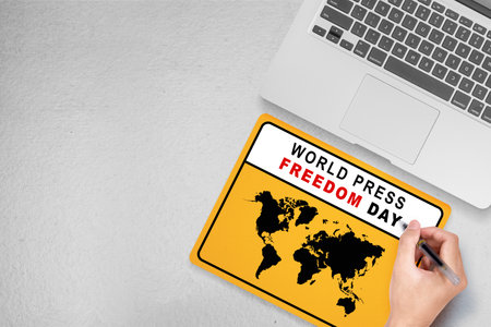 Humans hand write news on paper. World press freedom day concept