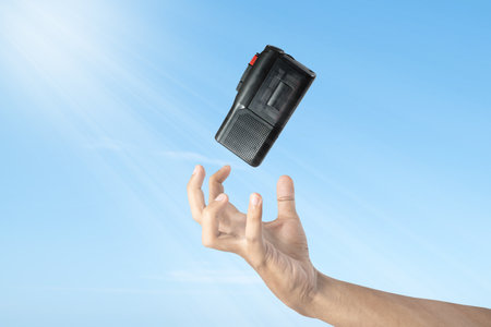 A human hand trying to reach a recording device. World press freedom day conceptの写真素材