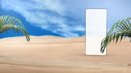 Mobile phone with an empty screen on the sand dune with blue sky backgroundの写真素材