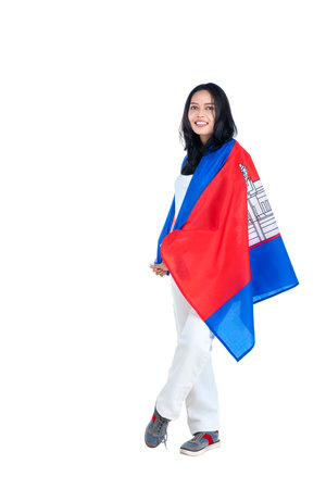 Asian women celebrate Cambodia independence day on 09 November by holding the Cambodia flag isolated over white backgroundの写真素材