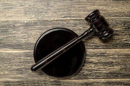 Judge gavel and soundboard on wooden desk. Law and justice concept