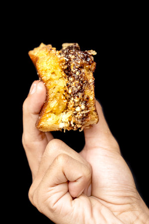 Sweet Martabak (Martabak Manis) on black background. Traditional Indonesia foodの写真素材