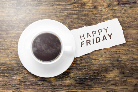 Coffee cup with a Happy Friday text. Happy Friday conceptの写真素材