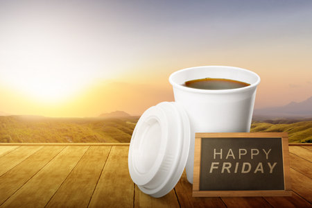 Coffee cup with a blackboard with a Happy Friday text. Happy Friday conceptの写真素材