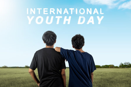 Rear view of man standing together. International Youth Day conceptの写真素材
