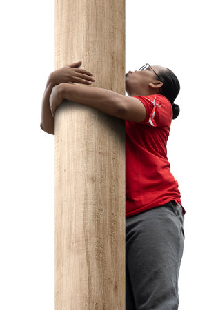Indonesian men celebrate Indonesian independence day on 17 August with a climb competition isolated...