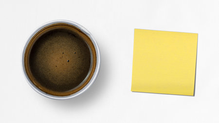 Cup of coffee with empty paper on white background. International coffee day conceptの写真素材