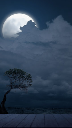 Dead tree with a full moon in the night. Scary Halloween background conceptの写真素材