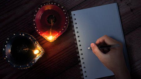 Diya oil lamps for the Diwali festival with empty paper for copy space. Diwali Festival. The Hindu Festival of Lights celebrationの写真素材
