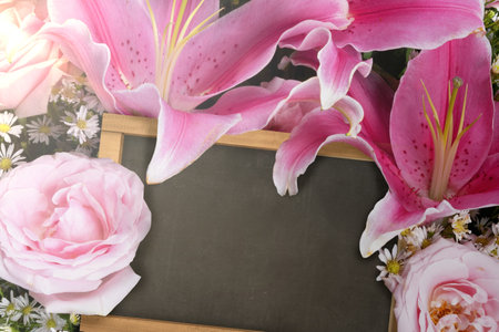 Colorful flower with empty chalkboard. Empty chalkboard for copy space. World Teacher Day concept.の写真素材