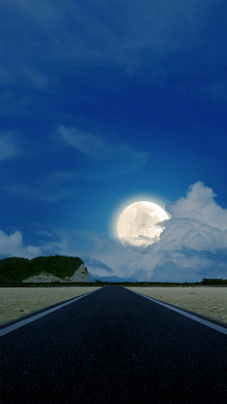 Asphalt road with a desert view with a full moon in the night backgroundの写真素材