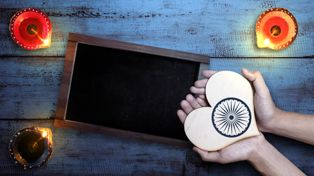 Diya oil lamps for the Diwali festival with an empty chalkboard for copy space. Diwali Festival. The Hindu Festival of Lights celebrationの写真素材