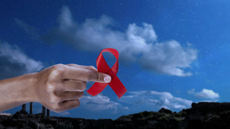 Human hand showing red ribbon awareness. World Aids Day concept