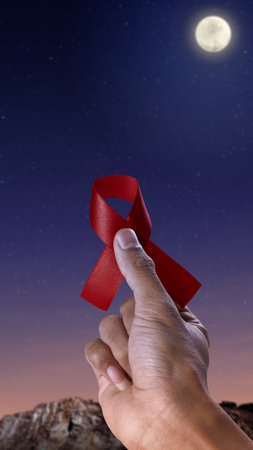 Human hand showing red ribbon awareness. World Aids Day conceptの写真素材