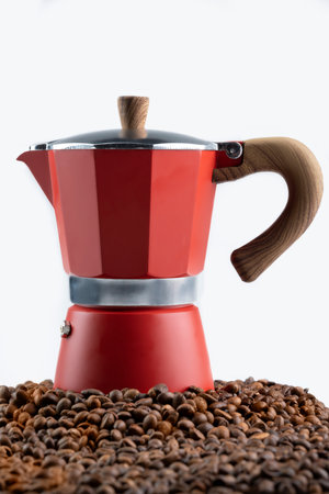 Coffee beans with a Moka pot coffee maker isolated over a white backgroundの写真素材