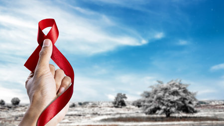 Human hand showing red ribbon awareness. World Aids Day conceptの写真素材